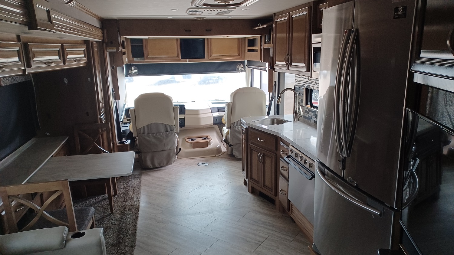 Fleetwood Bounder 35K kitchen and foward facing view of captains chairs